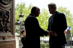 U.S. Secretary of State John Kerry is greeted by French Foreign Minister Laurent Fabius at the French Ministry of Foreign Affairs in Paris